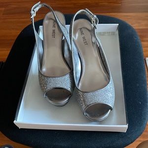 Womens platform sandal Size 7M Silver color , 3 and 3/4 inch high.